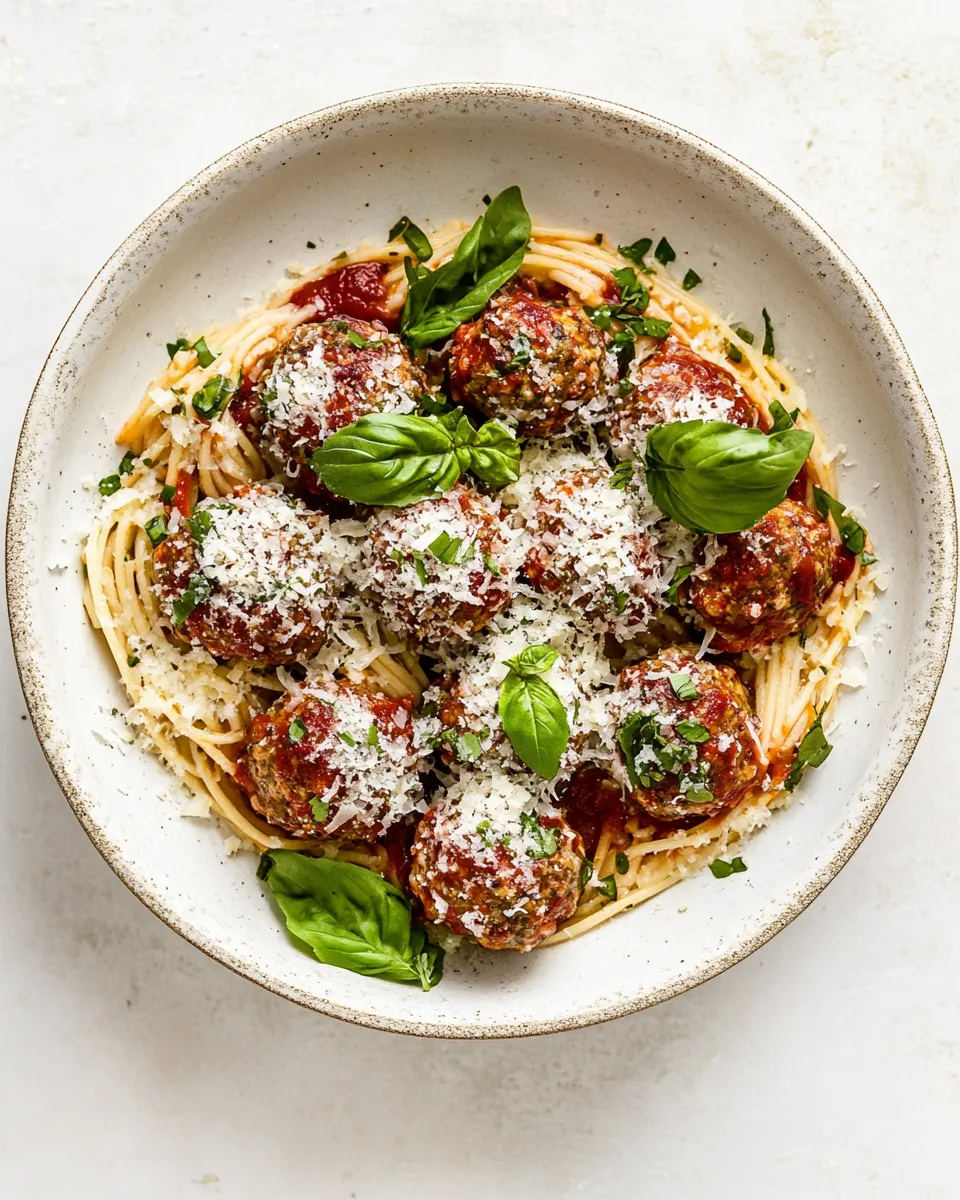 Simple Baked Chicken Parmesan Meatballs with Roasted Garlic Spaghetti. shot